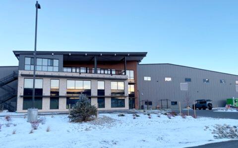 front entryway of Fading West's modular housing facility in Buena Vista. This image shows both the steel frame office/admin space and the pre-engineered metal building where modular homes are assembled and readied for shipping.