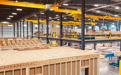 modular housing manufacturing facility photo showing assembly of modular homes.