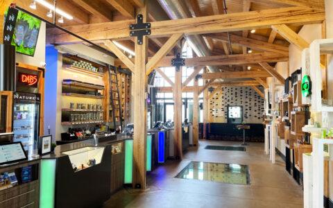 photo of the interior of the Miliken dispensary showing wood beams and display cases.